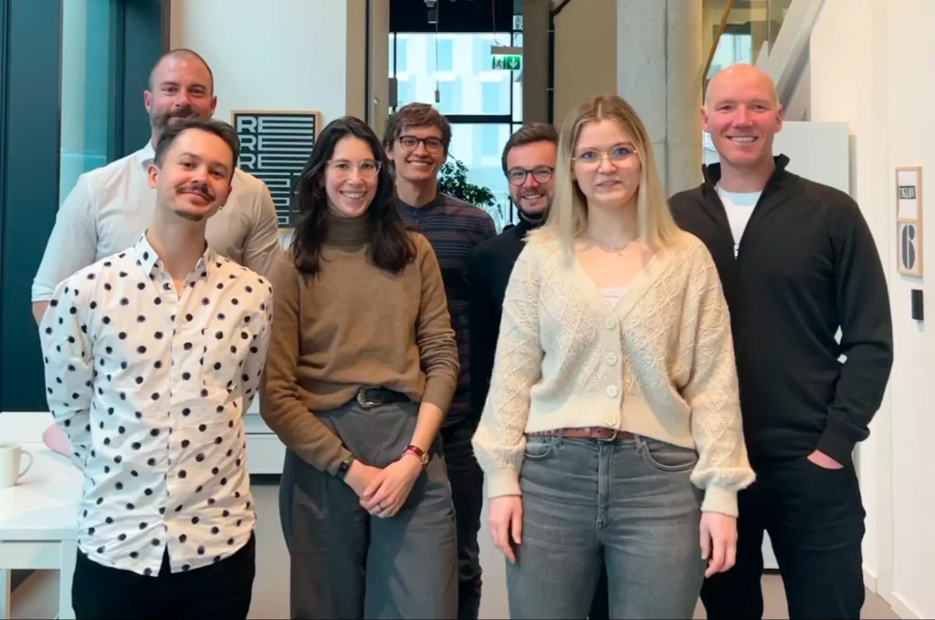 A diverse team smiling and standing together, representing innovation in agtech consisting of Farmable and Black Label companies.