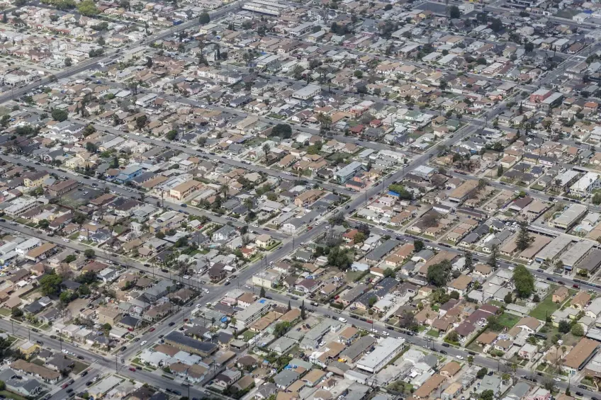 An aerial view of a dense suburban housing development in Los Angeles, showcasing a smart city's residential landscape.